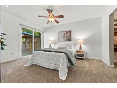 Staged bedroom with patio doors in a home staged by Willow & Fern
