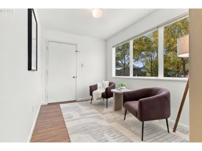 Staged sitting area by the window in a home staged by Willow & Fern